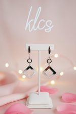 Sleek silver tone drop earrings